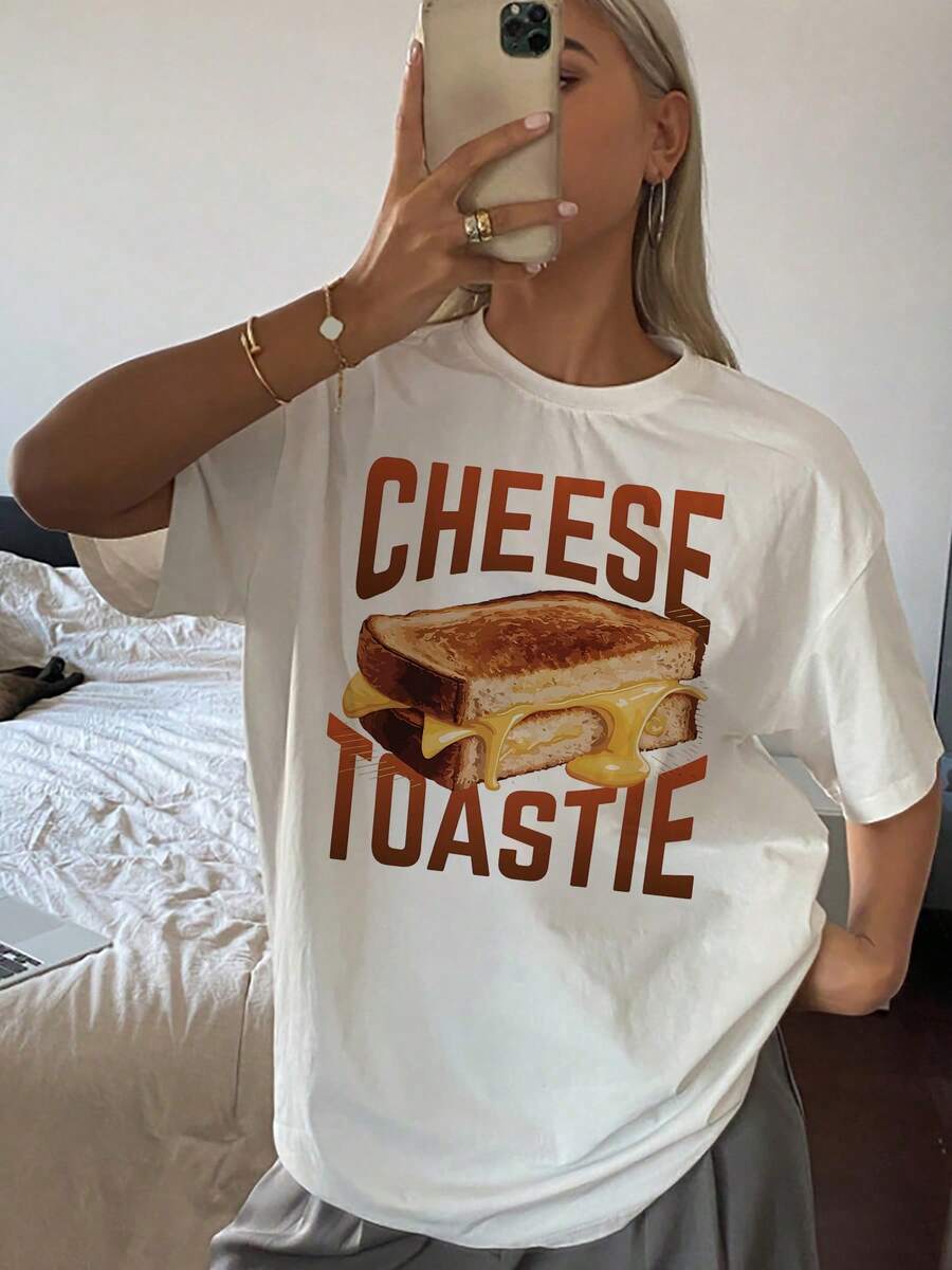 Moderna camiseta de manga corta para mujer con un vibrante estampado gráfico. Hecha con una cómoda y transpirable mezcla de algodón, es perfecta para un look casual y añade un toque de color a tu look diario. Esta elegante camiseta presenta un diseño único y está disponible en varias tallas.Tamaño extra grande - Blanco - Ver 1