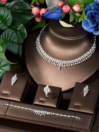 1 set mångsidiga smyckeset med kubisk zirkonia och vattendroppar, lämpliga för kvinnor att bära vid examensceremonin