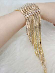 Braccialetto alla moda da donna con cristalli dorati e nappe