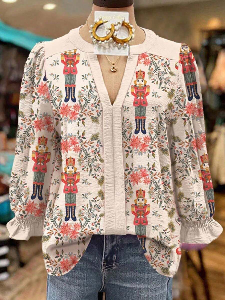 Nutcracker Printed V-Neck Shirt - Festive Contrasting Color Design, Decorated With Holiday Toy Soldier Patterns And Floral Accents - A Casual Long-Sleeved Top Suitable For Christmas Parties, Winter Outfits, And Daily Vibrant Looks - A Must-Have Item In Your Festive Wardrobe That Is Soft, Stylish, And Comfortable Against The Skin - Màu be - Xem 1