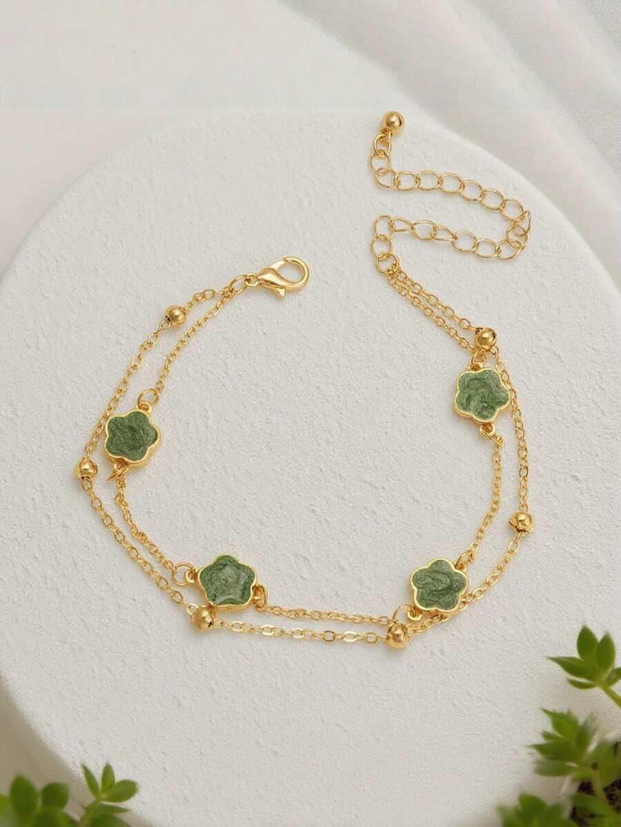 Chiếc vòng tay hình cỏ bốn lá màu xanh thanh lịch này là sự lựa chọn hoàn hảo cho Ngày Valentine, kỷ niệm và cả trang phục hàng ngày. Nó phù hợp để đeo hàng ngày và làm quà tặng trong các dịp lễ. - màu xanh lá - Xem 1