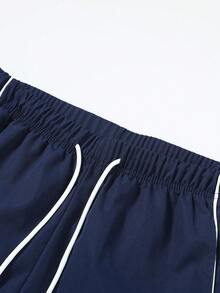 男士条纹拼布撞色休闲宽松直筒裤，适合春秋季节日常穿着、约会、户外运动、街头时尚、百搭