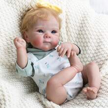 An 18-Inch (45 Cm) Adorable Lifelike Newborn Doll Made Of Vinyl Silicone, With Golden Hair And A Cute Face, Suitable As A Birthday Gift, Christmas Gift, Or Halloween Gift.