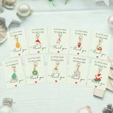 10件套女士圣诞节日钥匙扣套装 - 驯鹿、雪花、姜饼人、圣诞老人等，附赠感谢卡 - 坚固耐用的锌合金材质 - 送给老师、妈妈、女朋友、闺蜜的贴心礼物 - 生日、圣诞节、感恩节、教师节、婚礼、毕业典礼等场合皆宜，可作包包挂饰或汽车挂件，也可作为姐妹礼物。 - 彩色 - 查看 2