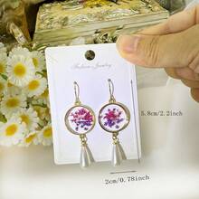 1 para świeżych kwiatowych kolczyków z żywicy liści, eleganckie kolczyki w kształcie okręgu z suszonych kwiatów, odpowiedni prezent dla kobiet na festiwale lub imprezy - Wielokolorowe - Zobacz 10