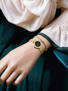 Anne Klein Damen-Armbanduhr mit goldfarbenem Kristall-Akzent und Armband im Set mit glänzendem schwarzem Zifferblatt, elegante Damen-Quarzarmbanduhr mit verstellbarem Armreif