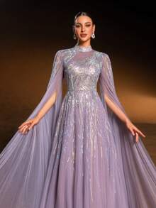 Faeriesty Haute Glamour Gorgeous Sheer Tulle Evening Gown With Cape Sleeves, Intricate Sparkly Beaded & Sequin Linear Geometric Patterns, Fitted Waist & A-Line Skirt | Glamorous Formal Design | Perfect For Red-Carpet Events, Wedding Guest Attire, Proms, And Upscale Evening Parties For Women