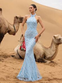 Elisanya 这款高级奢华的优雅露背美人鱼晚礼服，饰以繁复华丽的珠饰——修身胸衣凸显曼妙身姿，飘逸的美人鱼裙摆缀满层叠珠饰，是婚礼、舞会、盛大晚宴及女士派对等高端晚间聚会的理想之选。 - 淺藍色 - 查看 9