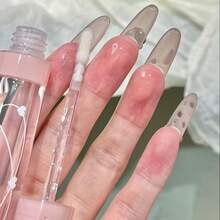 HER ORANGE HERORANGE Crystal Transparent Lip Oil - Dưỡng ẩm lâu trôi, chống bong tróc, chống thấm nước, chống mồ hôi, làm mờ các nếp nhăn trên môi, tạo hiệu ứng môi căng mọng như thủy tinh, dễ thoa. Phù hợp cho cả nam và nữ, học sinh, hoạt động ngoài trời, mọi mùa, mọi dịp. Chăm sóc môi đẹp. - Nhiều màu - Xem 5
