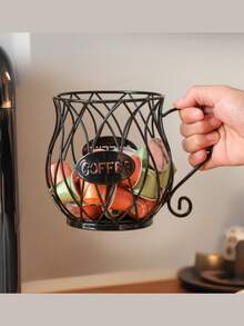 Un porte-capsules de café doré, panier de rangement pour capsules de café, étagère de rangement de collations et bonbons de luxe léger, panier de rangement pour capsules de café convenant aux comptoirs de bar, en métal, convenant aux cafés et hôtels domestiques, noir