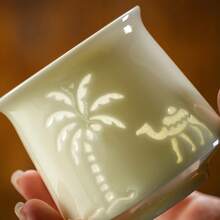 1 pieza Taza de espresso de cerámica, taza de té, diseño hueco creativo, estilo del desierto de Oriente Medio, árbol de coco de camello, la belleza del arte del vasto desierto, taza simple y exquisita de alta gama, resistente a altas temperaturas, sensación cómoda, alta calidad, taza de té para oficina y hogar, muy adecuada para uso personal o regalo