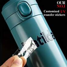 50 包定制 UV 3D 转印贴纸 - 个性化 DTF 印刷，高品质防褪色，适用于定制标签、名片、婚礼、生日、派对装饰 - 兼容玻璃、塑料、金属和织物 - 一次性（50 张）、个性化贴纸、活动品牌推广、增亮效果、高品质印刷和活动策划。 - 彩色 - 查看 1