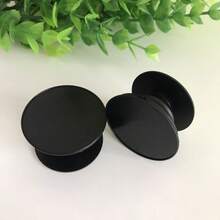 创意折叠式软垫支撑架，确保手机稳固握持，气囊式手机支架更是懒人的理想之选。兼容和安卓手机，可作为生日、家人、朋友的礼物。推拉式手机握把配件 - 黑色 - 查看 10