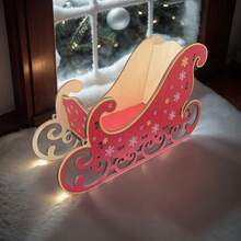 Ein hölzerner 3D handgefertigter Mini-Weihnachtsschlitten, geeignet für die Tischdekorationen.