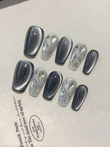 10片美甲贴纸，DIY超大猫眼星空图案，黑色可拆卸可重复使用指甲贴，适用于舞台、舞蹈、舞会、派对等场景。内含1盒指甲胶和1个指甲抛光器。按压式美甲用品