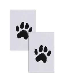 这款特别设计的两件套套装，让宠物爱好者轻松捕捉宠物的可爱瞬间，例如狗狗们开心玩耍的瞬间。套装内含免洗印泥，确保在制作爪印时双手保持清洁。相框尺寸适中，可摆放在书桌、床头柜或客厅，打造温馨的家居装饰。