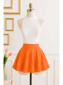 Conjunto de dos piezas de top corto informal con cuello alto acanalado y minifalda acampanada para mujer ideal para fiestas y verano. - Naranja - Ver 3