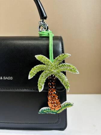 1件撞色串珠饰品，饰以优雅、时尚、简约、可爱、百搭、俏皮有趣的植物图案。夏季椰树造型，椰树图案，可作背包、单肩包、斜挎包、手提包、腋下包、化妆包、其他收纳包、吊坠、车挂件、钥匙扣、裤腰挂件、行李箱挂件、身份识别挂件等。适合情侣、女友、学生、男女皆宜，可用于工作通勤、日常约会、假期、旅行等场合。也适合男士，是节日、送给女友、母亲、小礼物、生日礼物的理想之选。