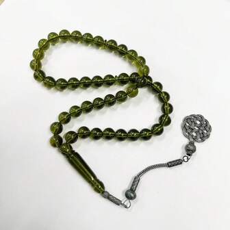 A Bracelet Composed Of 45 Synthetic Resin Prayer Beads, An Islamic-Style Prayer Bead Bracelet, Paired With A Non-Fading Alloy Pendant. The Color Is Transparent And The Touch Is Fine. This Muslim Prayer Bead Bracelet Is Suitable For Both Men And Women, And The Color Of The Pendant Does Not Fade.