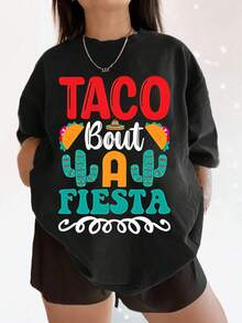 Camiseta gráfica para mujer Taco Bout A Fiesta, con un lindo estampado de cactus y sombrero de paja, una blusa informal de manga corta y cuello redondo, y un divertido atuendo para celebrar el Cinco de Mayo. Talla extragrande. - Negro - Ver 1