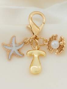 1个A-Z字母金色泡泡字母吊坠钥匙扣，饰以海星和贝壳配件，可用作钥匙扣、戒指、包包挂饰、背包挂件、汽车挂件，非常适合购物、海滩、露营、钱包和手提包，是送给女性、朋友、学生的理想礼物，时尚创意设计，生日礼物、夏季包包挂饰、万圣节配饰、教师节礼物。 - 彩色 - 查看 10