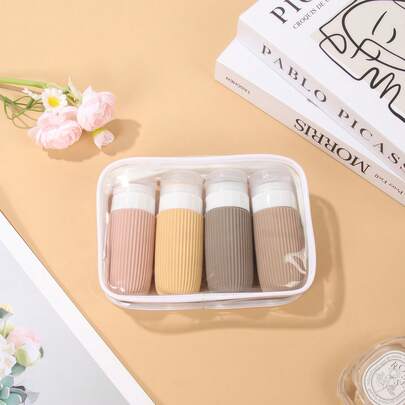 4个TSA认证的2盎司旅行水瓶，防漏旅行装洗漱用品，可重复灌装，附赠洗漱包，是旅行季和邮轮旅行的必备品。