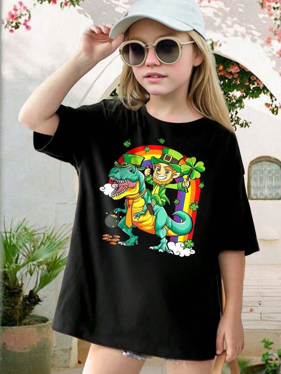 Funny St. Patrick's Day T-Shirt - Leprechaun Riding Dinosaur Rainbow Tee - Irish Clover Lucky Charm Graphic Tee For Men Women Kids - Perfect For St. Paddy's Day Parties Celebrations! Teen Youth Sizes Available - màu đen - Xem 1