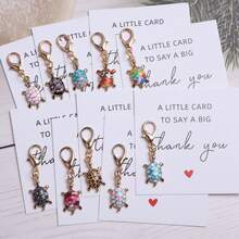 10件独特趣味海龟钥匙扣礼品套装，附赠感谢卡和卡片。可爱的海龟吊坠装饰，可用于背包、手提包和车钥匙。是生日、婚礼、单身派对、圣诞节、万圣节、情人节、新年、毕业典礼和返校节等场合的绝佳礼物，适合送给家人、朋友、情侣和同学。 - 彩色 - 查看 13