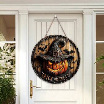 2D 平面，1 件万圣节主题圆形挂饰，带有南瓜头、女巫帽、蝙蝠元素和“TRICK OR TREAT”文字，营造节日氛围，适合家庭门廊、墙壁装饰、万圣节装饰爱好者