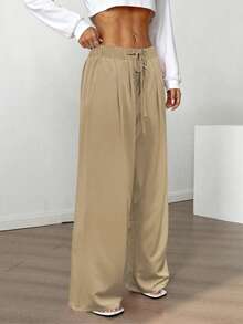 飘逸阔腿裤：轻盈梭织面料搭配弹性抽绳腰带，修身百搭，适合通勤、购物、居家休闲等各种场合。2026春秋新款休闲女裤，适合约会、学生和日常出行。百搭款式，休闲百搭，可轻松驾驭海滩等各种场合。抽绳腰带设计，休闲舒适，适合外出和居家穿着。 - 卡其色 - 查看 6