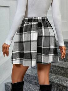 Nueva colección de Navidad y otoño-invierno con una falda casual a cuadros en blanco y negro, de estilo minimalista y elegante. Perfecta para fiestas, con talle alto, forro grueso y un ajuste favorecedor para la figura de la mujer. Adecuada para diversas ocasiones, como salidas diarias, eventos escolares y fiestas navideñas.