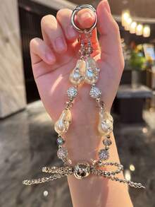 Corona de perlas falsas colgante, Lazo asimétrico de perlas falsas para correa de teléfono, Funda de teléfono con cuentas de cristal, Colgante de bolso, Llavero
