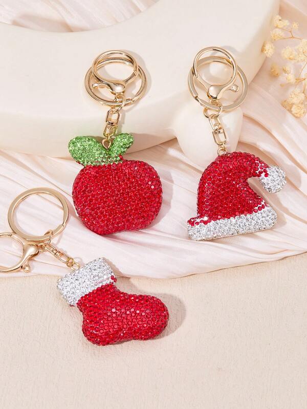 Weihnachtsthematischer glänzender Schlüsselanhänger, erhältlich in Apfel-/Hut-/Socken-Designs. Geeignet als Taschen- oder Schlüsselanhänger und auch ein ausgezeichnetes Urlaubsgeschenk.