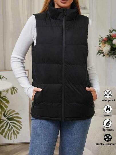 Gilet sans manches matelassé noir pour femmes, style urbain automne-hiver. Veste légère et chaude avec col montant, fermeture éclair. Idéal pour le port casual au quotidien, les trajets de bureau, les courses du week-end, les rassemblements festifs et les sorties par temps froid.