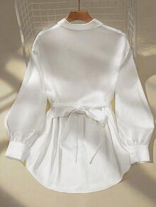 Elegant White Collared Long Sleeve Shirt For Women, Made Of Slightly Stretchy Polyester With A Belted Design And Asymmetrical Long Length