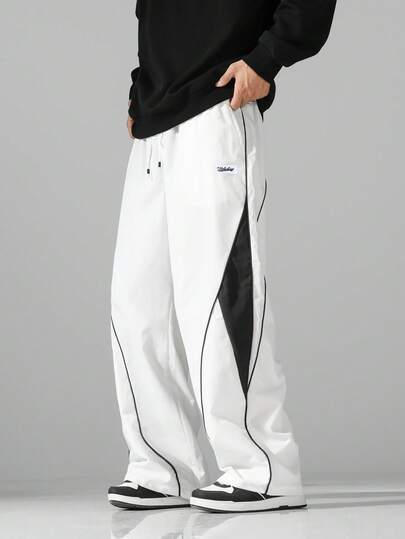 男士街头风运动裤 - 轻盈涤纶运动裤，侧边条纹，带口袋和抽绳腰带，撞色休闲运动裤，适合街头穿着、慢跑、户外休闲、健身房等场合，时尚百搭。