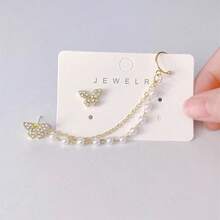 1 par de clips de oreja con cadena de borlas, cristales de imitación y perlas falsas con diseño de mariposa - Clips de oreja asimétricos de micro-cristal sin perforación para mujeres, pendientes de moda coreana para citas/fiestas, joyería hipoalergénica, regalo de Navidad, accesorios para mujeres, juego de pendientes elegantes de acero inoxidable dorado, pendientes de Navidad, accesorios de pendientes para mujeres por menos de 10 pesos