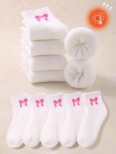 5双白色蝴蝶结儿童秋冬袜，适合女童日常休闲穿着。