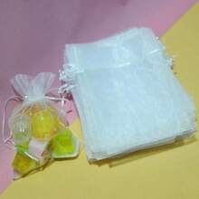 Bolsa de regalo de joyería transparente con cordón, se puede usar como decoración de regalo y es fácil de transportar, adecuada para bodas, despedidas de soltera, promociones de fiestas, exhibición de joyería y bolsas de regalo de Navidad. Estilo/color aleatorio de bolsa de caramelos