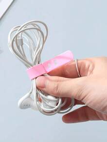 Organisateur de câbles en silicone à 5 trous : Permet de ranger et d'accéder facilement aux écouteurs, chargeurs et câbles de données ! Organisateur de câbles en silicone réutilisable pour ranger et gérer les fils, avec sangles et clips multifonctions, convient à la conservation des aliments et au rangement des cordons d'écouteurs. (Couleur aléatoire)