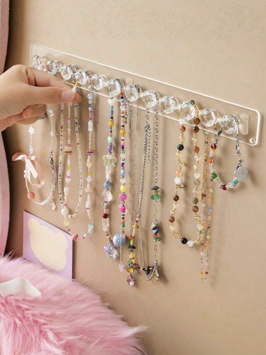 1 pièce Support organisateur de bijoux pour colliers, bracelets, boucles d'oreilles et bagues. Présentoir mural transparent pour table de maquillage, armoire à glace. Crochet multifonctionnel de rangement de bijoux pouvant être utilisé dans les dortoirs scolaires, organisateur de stockage d'été, cadeau de rentrée scolaire