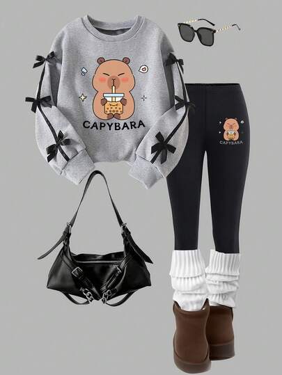 Set med rund halsringning och tröja och leggings för tweenflickor