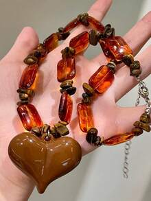 Collar con colgante de corazón de piedra de ojo de tigre de resina, estilo europeo y americano, collar gargantilla versátil y vintage, accesorio de collar único y de alta gama