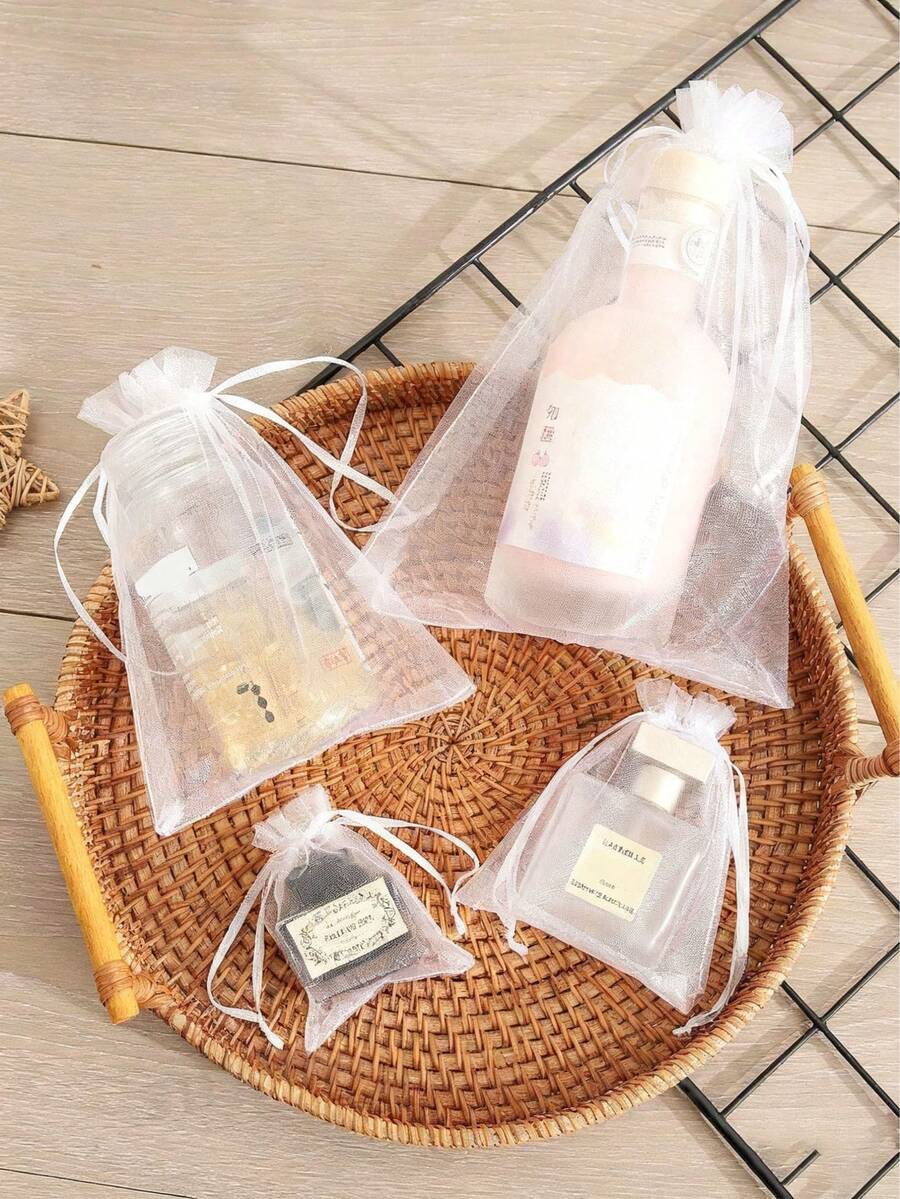 Bolsa de regalo de joyería transparente con cordón, se puede usar como decoración de regalo y es fácil de transportar, adecuada para bodas, despedidas de soltera, promociones de fiestas, exhibición de joyería y bolsas de regalo de Navidad. Estilo/color aleatorio de bolsa de caramelos