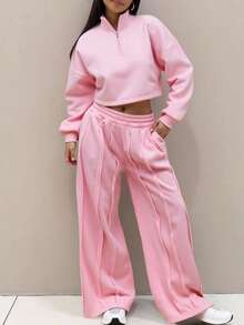 مجموعة قطعتين مكونة من بلوزة قصيرة مقصوصة الكتف مع سحاب نصف طول الرقبة وبنطلون رياضي مستقيم الساق مع ثني الخياطة، بنطلون رياضي واسع الساق مناسب للربيع والعطلات والمطار والأوقات العادية في الخريف والشتاء والعودة إلى المدرسة