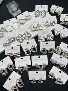 18 Pieces / 9 Pairs. Stainless Steel Heart-Shaped/Leaf-Shaped/Wing-Shaped Earrings. Various Styles Can Be Freely Combined. Suitable For Women's Daily Wear.