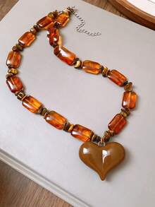 Collar con colgante de corazón de piedra de ojo de tigre de resina, estilo europeo y americano, collar gargantilla versátil y vintage, accesorio de collar único y de alta gama