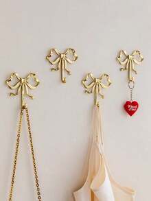 Gold Bowknot Wall Hook, Gold Bowknot Hanger, Brass Bowknot Wall Hook, Door Hook, Towel Hook, Brass Clothing Hook, Suitable For Wedding, Bathroom, Living Room, Kitchen Decor Hanging Hook, Brass Metal Wall Mounted Clothes Rack, Suitable For Living Room And Bathroom, Painted Surface, Easy To Install, Retro Ribbon Design Hook, Suitable For Bedroom And Bathroom, Nordic Retro Clothes Hook, Clothes Hook, Bedroom Porch Bathroom Decor, Solid Brass Bowknot Shaped Wall Hook