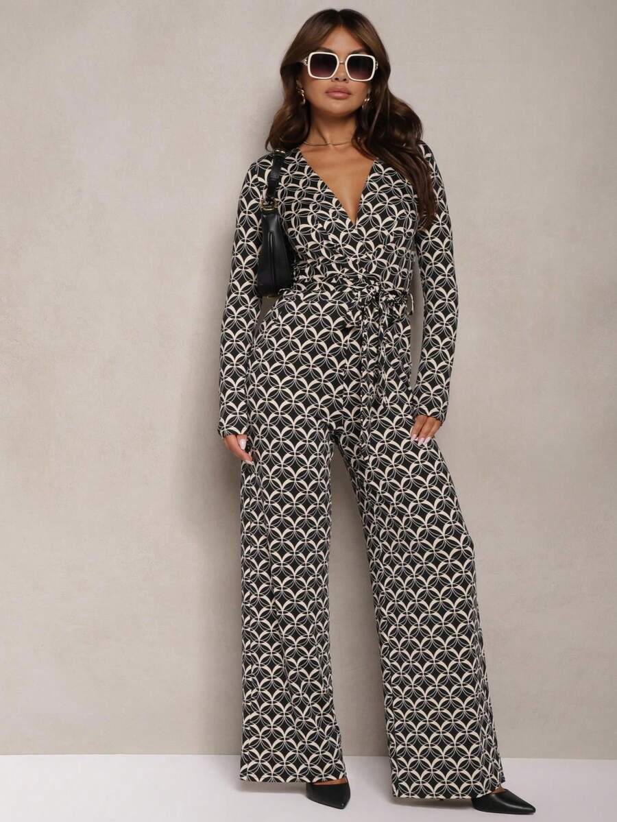Mono con estampado, cuello en triángulo y cinturón en la cintura - Negro - Ver 1