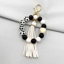 A Leopard Print Silicone Wood Bead Bracelet Keychain With PU Leather Tassels, Fashionable Bag Dration, And Women's Gift